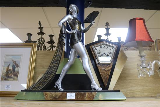 A French Art Deco bronzed spelter and marble mantel clock, the dial signed Divay height 58cm